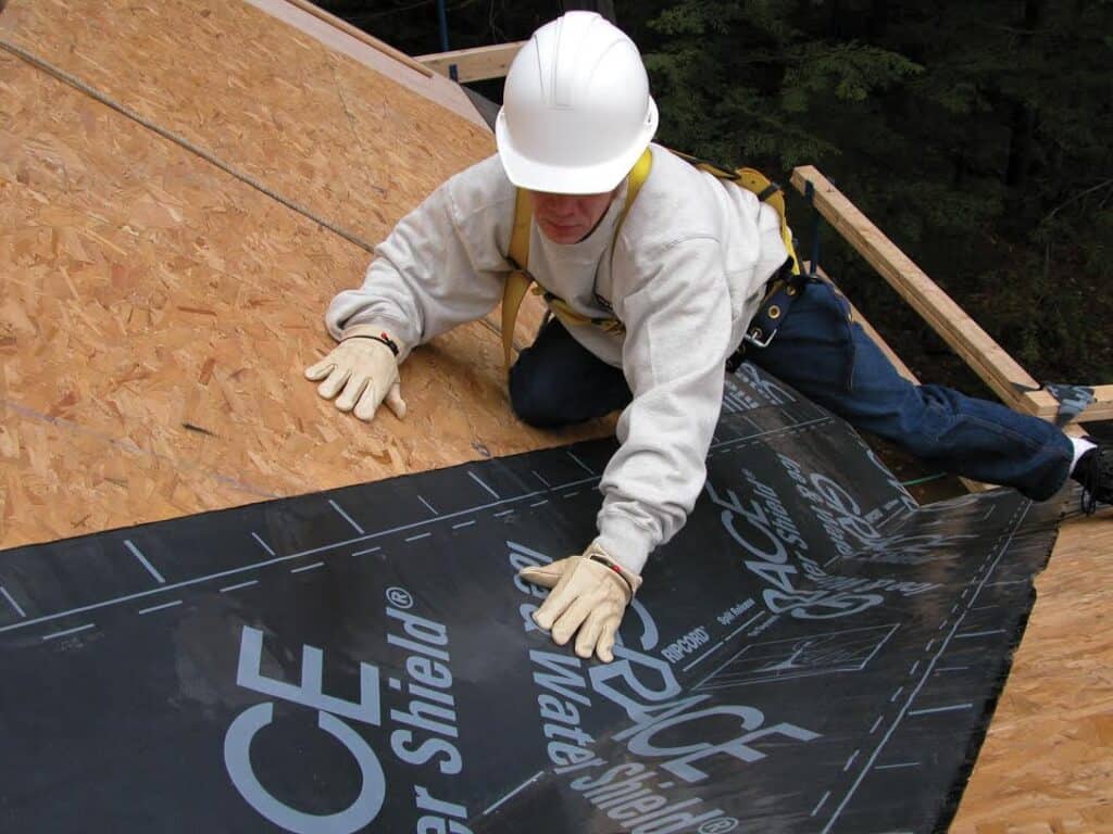 a worker installing ice and water shield